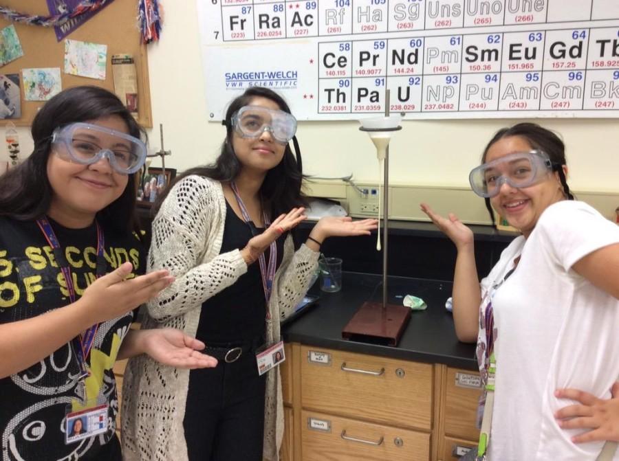 This is one of the images Katovich tweeted out during chemistry class to promote student learning. Jazlynn Millan, Anum Paya, and Diana Moran are proud of their work.
