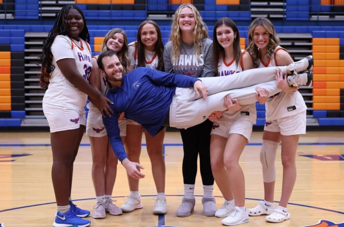 (Right to left) Zion Oyeleke, Ella Steel, Coach Brad Riebel, Maddie Frank, Alyson Sankey, Olivia Ingraffia, Kendall Burdick 